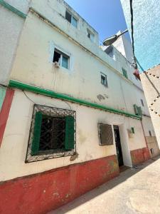 a building with a window on the side of it at casa celia in Asilah