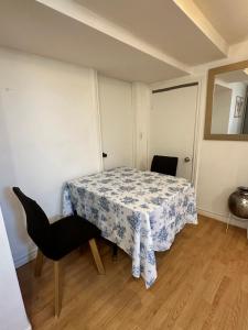 a small room with a table and a chair at 1 Bedroom Basement Apartment Owen Sound in Owen Sound