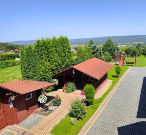 an overhead view of a building with a roof at Noclegi Na Wzgórzu in Krajno Pierwsze