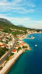an aerial view of a town next to the water at Vila Fjaka in Dugi Rat