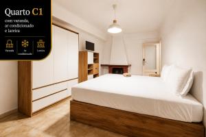 a bedroom with a large white bed in a room at Rooms4you 3 in historic center of Braga in Braga