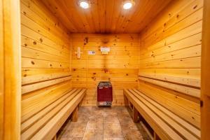 a wooden sauna with benches in a cabin at Beautiful Home, Views, Near Whiteface, Lake Placid in Wilmington