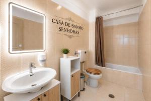 a bathroom with a sink and a toilet at Rooms4you 3 in historic center of Braga in Braga +39 photos