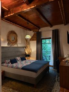 a bedroom with a large bed in a room at Detlafówka Kaszubski Resort in Dębki