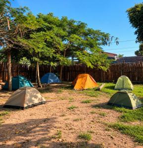 a group of tents sitting in the grass at Camping & Glamping For All in Itaúnas