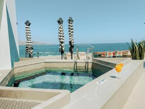 a swimming pool with a view of the ocean at Occidental Las Canteras in Las Palmas de Gran Canaria