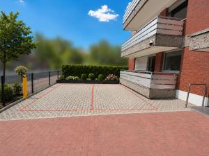 a brick driveway in front of a building at Pulheim Living 6 in Pulheim