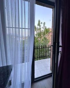 an open door with a view of a balcony at City Center in Vanadzor +1 photo