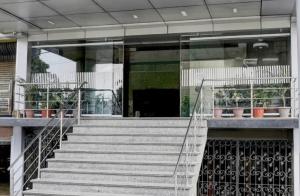 a building with stairs in front of a building at Hotel Kohinoor, Bharuch in Bharūch