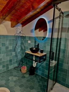 a bathroom with a sink and a mirror at Agriturismo Yucca in Giustenice +18 photos