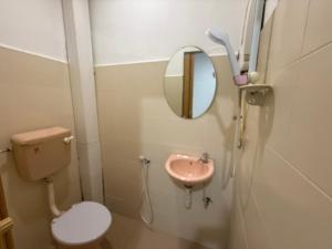 a small bathroom with a toilet and a sink at Hotel Empire Banting in Banting