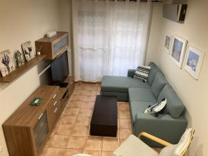 a living room with a couch and a table at Casa Althaya in Alcalà de Xivert +17 photos