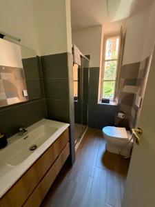 a bathroom with a tub and a sink and a toilet at Residence Emporium in Rome +20 photos