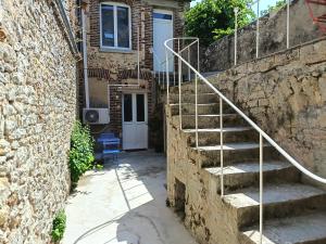 a set of stairs leading up to a house at L'instant Désir love room jacuzzi in Ferrières