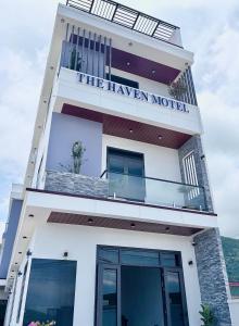 a building with a sign that reads the haven model at The Haven Motel in Chú Cư +22 photos