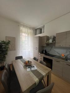 a kitchen with a wooden table in a room at Residence Emporium in Rome