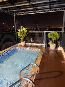 a hot tub on the roof of a building at Tulip Building in Ðông Khê