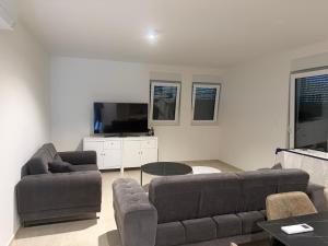 a living room with a couch and a table at Baden Resort Bašanija, Umag-with Sea View, Parking and 300m from the beach in Bašanija