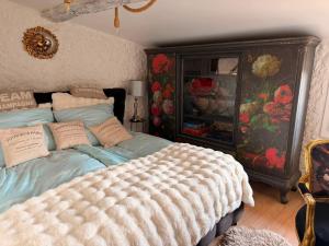 a bedroom with a bed and a dresser at Le Château de Soleil in Saint-Pons-de-Mauchiens +80 photos
