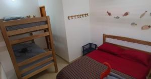 a bedroom with a bunk bed and a ladder at Casa MACONDO BEACH HOUSE in Rincón