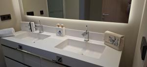 a bathroom with two sinks and a large mirror at Natural Beatriz Luxury Villa Baby Package Included in Lajares