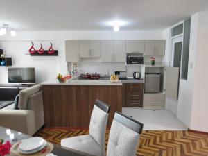 Dapur atau dapur kecil di Apartamentos Quewe