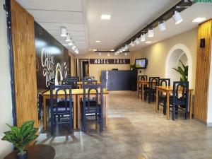 a dining room with tables and chairs in a restaurant at Fran hotel boutique in Mendoza