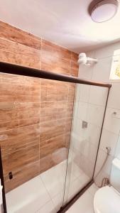 a bathroom with a shower and a toilet at Uma Janela Para o Sol in Morro de São Paulo +29 photos