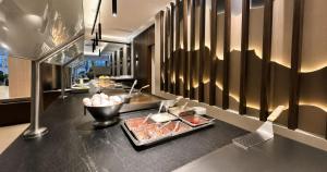 a buffet in a hotel room with food on a counter at Panorama in San Luis Potosí