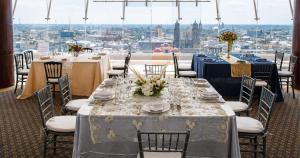 a table set up for a wedding in a room with a view at Panorama in San Luis Potosí