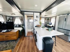 a kitchen and living room of a airstream caravan at Box Villages Pecos in Pecos