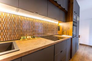 a kitchen with a sink and a counter top at Fakanalas Fogadó in Pásztó +134 photos