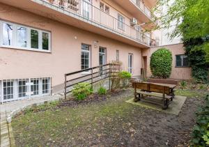 a bench sitting in front of a building at Calm Center Modern Apartment in Staré Mesto