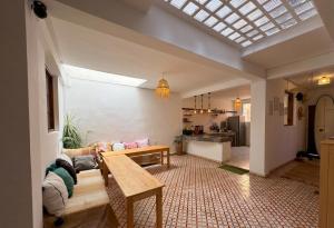 a living room with a couch and a table at Eco Bay Surf House in Agadir