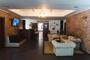 Un televizor și/sau centru de divertisment la Hotel Regina