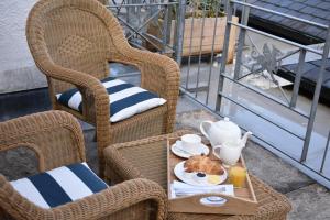 a tray with a breakfast of eggs and coffee on a table at Plas Dolguog in Machynlleth