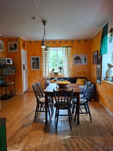 a dining room with a table and chairs at Frida in Filipstad