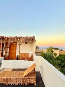 a room with a bed and a view of the ocean at Bedro Rooftop Studio 2 Private Balcony Sea View 30 Sec to Sea in Dahab