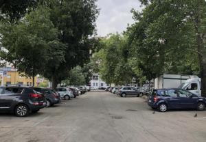 a bunch of cars parked in a parking lot at "HOUSE OF LELLA 2" appartamento 1 camera da letto - M1 METRO ROSSA in Milan