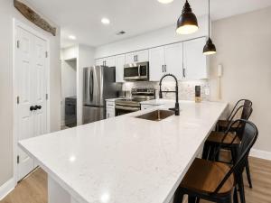 a kitchen with white cabinets and a white counter top at 2Br 2Ba Condo on Golf Course in Pawleys Island