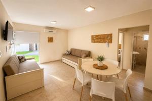 a living room with a couch and a table at Altos de Alem in Federación
