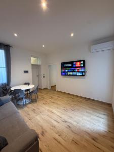 a living room with a couch and a table at Civico 8 Apartment in Sassari