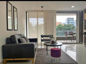a living room with a couch and a table at Imperial house in Envigado