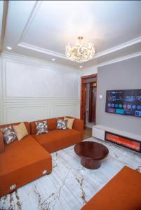 a living room with a couch and a coffee table at Elazoh Apartments in Kisumu