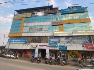 a building with motorcycles parked in front of it at Kesang Stay in Diphu