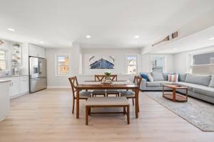 a living room with a table and a couch at Bradley Beach Compound in Bradley Beach