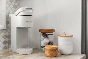 a kitchen counter with a coffee maker and a mixer at Bradley Beach Compound in Bradley Beach +47 photos