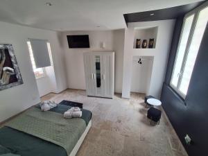a bedroom with a bed and a television in it at Sogno nella Corte in Bitonto