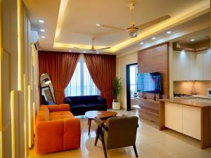 a living room with a couch and a table at 1 Bedroom Premium Executive Apartments DHA Lahore in Lahore
