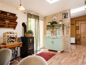 a living room with a blue cabinet and a table at ROSE ROOM for 4 guests in green Rose resort Ljubljana in Ljubljana